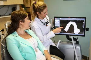 Doctor explaining dental crowns to patient